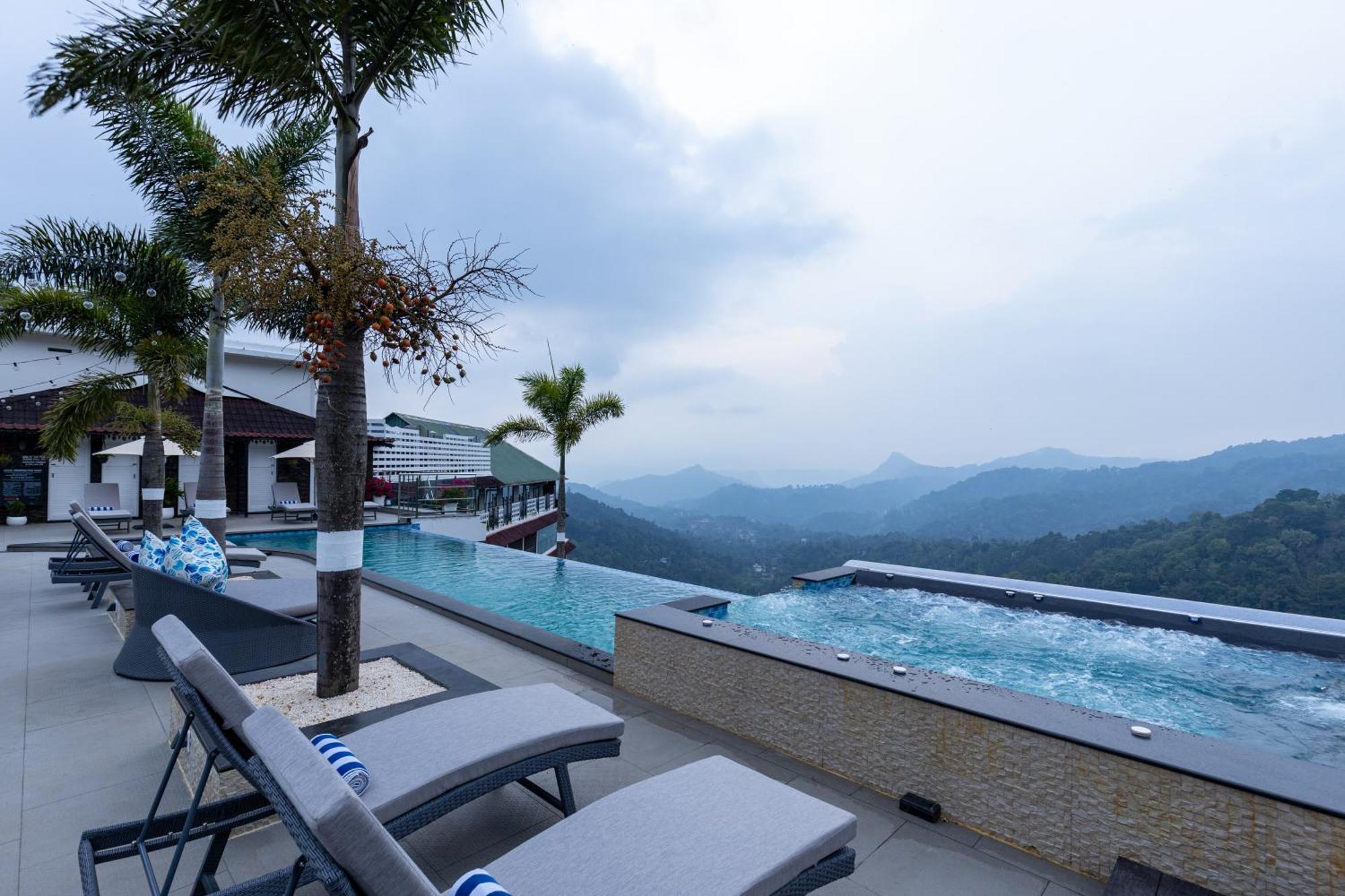 The Panoramic Getaway Hotell Munnar Eksteriør bilde The swimming pool at the resort