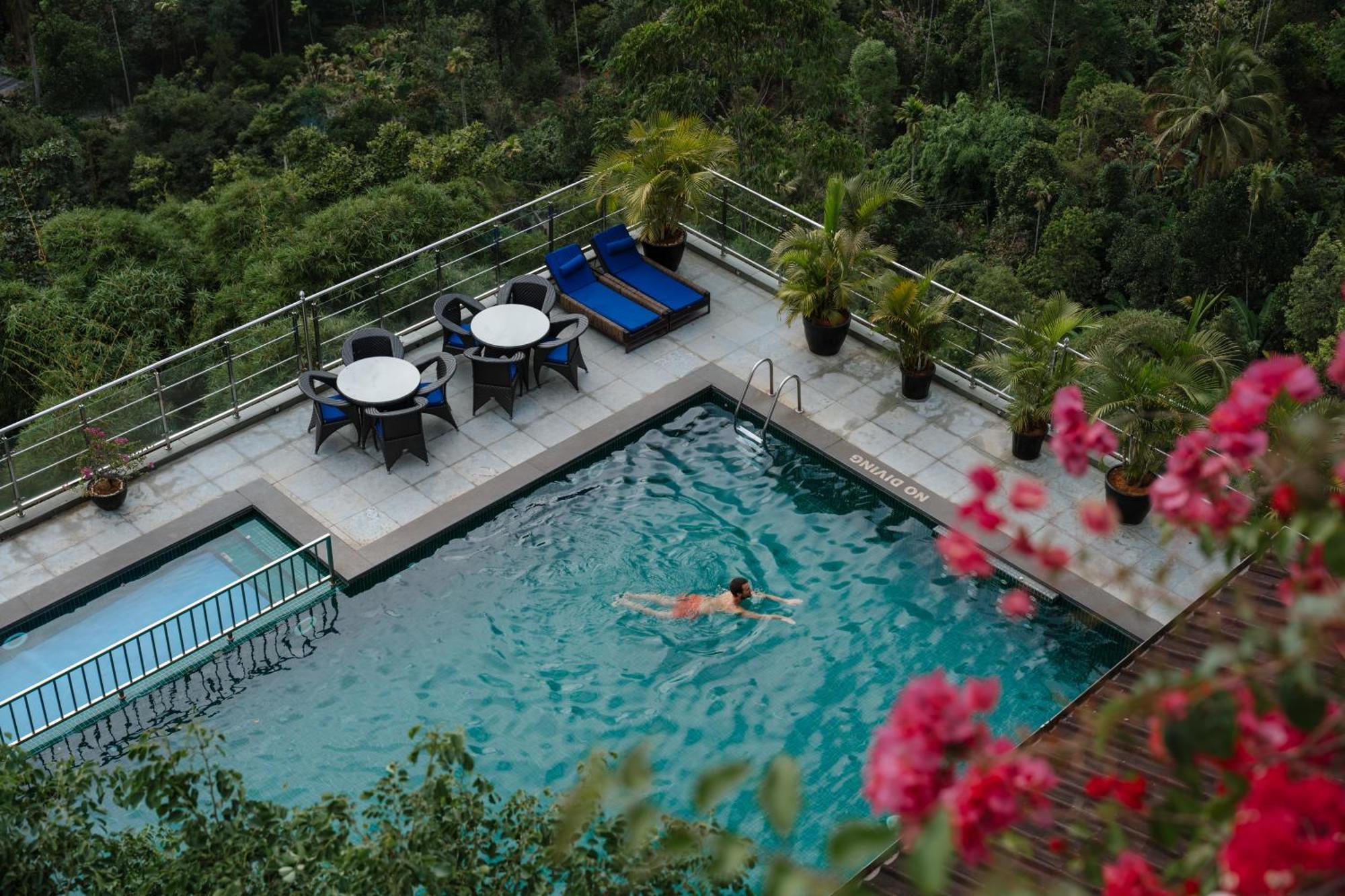 The Panoramic Getaway Hotell Munnar Eksteriør bilde The swimming pool at the hotel