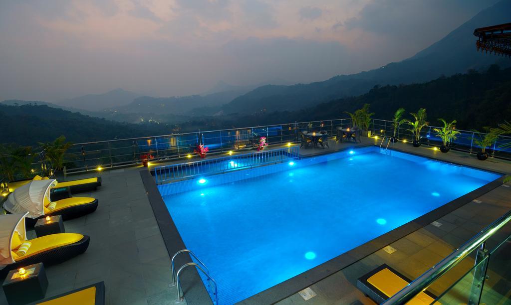 The Panoramic Getaway Hotell Munnar Eksteriør bilde The swimming pool at the resort