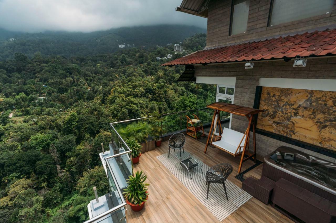 The Panoramic Getaway Hotell Munnar Eksteriør bilde A view from the balcony of a house in Kerala, India